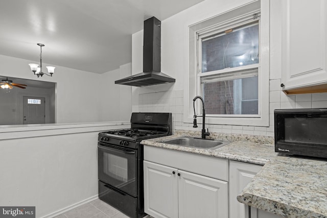 1504 N 57th St, Philadelphia, PA 19131 - kitchen with black gas stove, wall chimney exhaust hood, a sink, and decorative backsplash