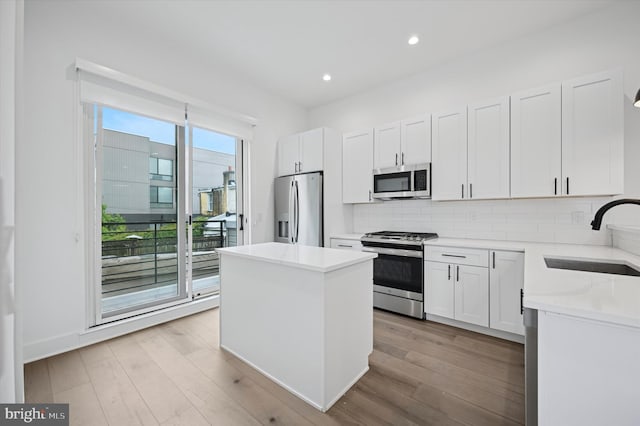6522 Magnolia St, Philadelphia, PA 19119 - kitchen with appliances with stainless steel finishes, a sink, a center island, recessed lighting, and decorative backsplash