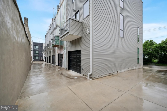 6522 Magnolia St, Philadelphia, PA 19119 - view of side of property with an attached garage and concrete driveway