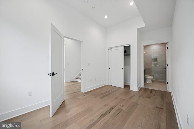 6522 Magnolia St, Philadelphia, PA 19119 - unfurnished bedroom with light wood finished floors, connected bathroom, a closet, baseboards, and recessed lighting