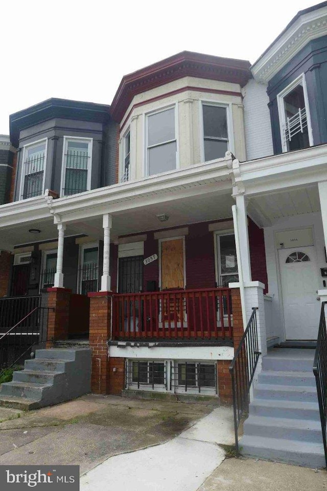 3057 Brighton St, Baltimore, MD 21216 - multi unit property with a porch and brick siding