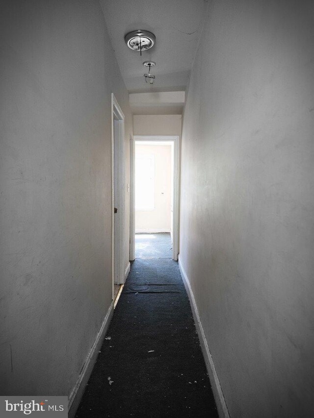 3057 Brighton St, Baltimore, MD 21216 - corridor featuring baseboards and carpet floors