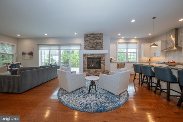 11 Ridings Way, West Chester, PA 19382 - living area with hardwood / wood-style flooring, a stone fireplace, and recessed lighting