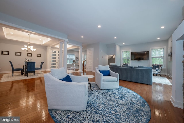 11 Ridings Way, West Chester, PA 19382 - living area featuring decorative columns, baseboards, hardwood / wood-style flooring, recessed lighting, and a chandelier