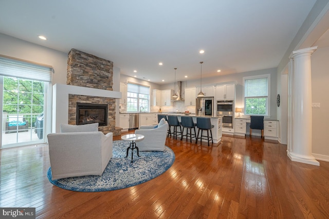 11 Ridings Way, West Chester, PA 19382 - living area with hardwood / wood-style flooring, decorative columns, a fireplace, baseboards, and recessed lighting
