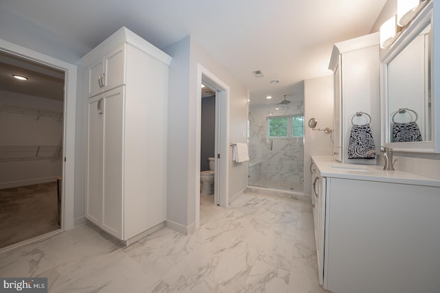 11 Ridings Way, West Chester, PA 19382 - full bathroom featuring marble look tiles, a marble finish shower, toilet, vanity, and baseboards