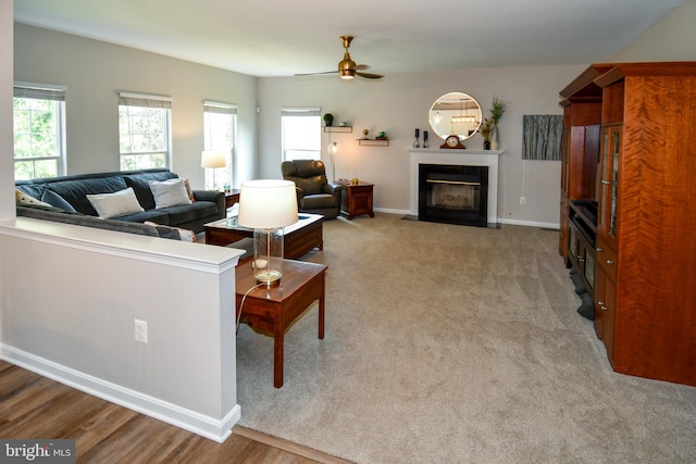 9111 Dartford Pl, Bristow, VA 20136 - living area featuring a fireplace with flush hearth and a ceiling fan