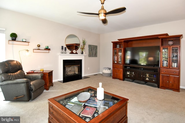 9111 Dartford Pl, Bristow, VA 20136 - carpeted living area with a ceiling fan and a glass covered fireplace