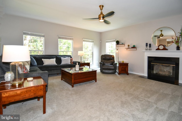 9111 Dartford Pl, Bristow, VA 20136 - living area with ceiling fan, plenty of natural light, a fireplace with flush hearth, and light carpet