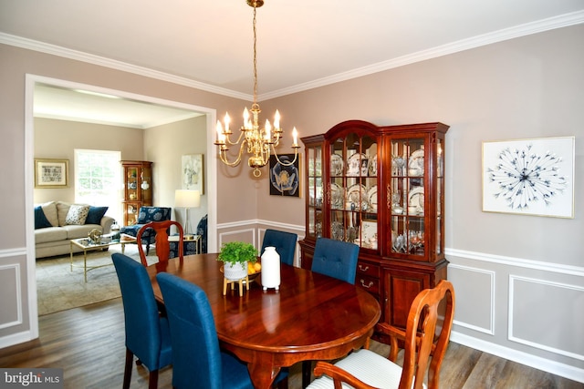 9111 Dartford Pl, Bristow, VA 20136 - dining space with a chandelier, dark wood-type flooring, and crown molding