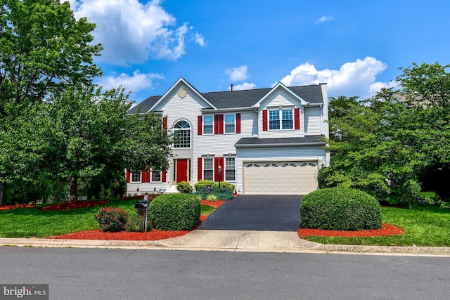 9111 Dartford Pl, Bristow, VA 20136 - view of front of property with asphalt driveway and a garage