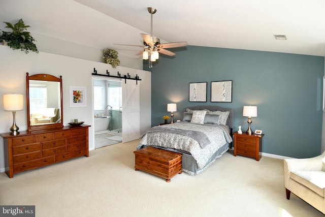 9111 Dartford Pl, Bristow, VA 20136 - bedroom featuring vaulted ceiling, carpet flooring, ensuite bath, a barn door, and a ceiling fan