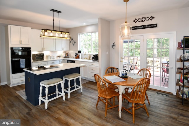 9111 Dartford Pl, Bristow, VA 20136 - dining space featuring dark wood finished floors and recessed lighting