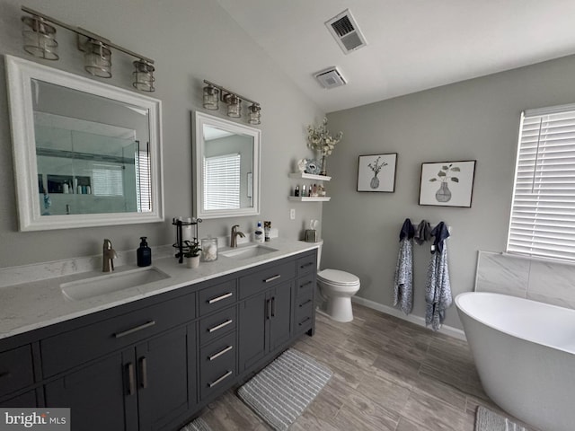 9111 Dartford Pl, Bristow, VA 20136 - full bath featuring double vanity, a stall shower, and a soaking tub