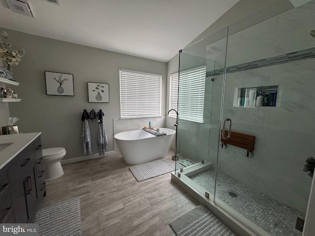 9111 Dartford Pl, Bristow, VA 20136 - full bath with vaulted ceiling, a soaking tub, vanity, and a shower stall