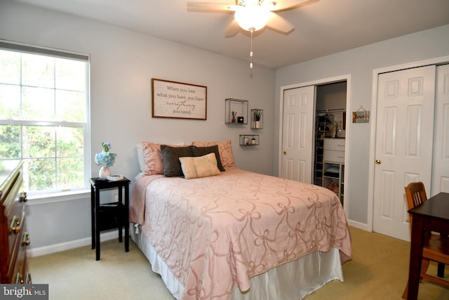 9111 Dartford Pl, Bristow, VA 20136 - bedroom with light carpet, multiple closets, and ceiling fan