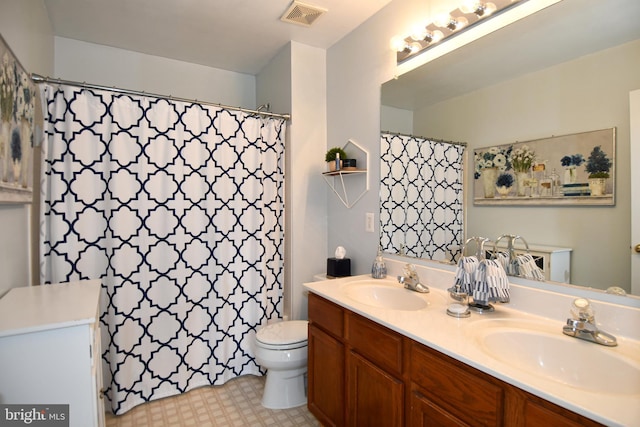 9111 Dartford Pl, Bristow, VA 20136 - full bathroom featuring double vanity, a shower with shower curtain, and tile patterned floors