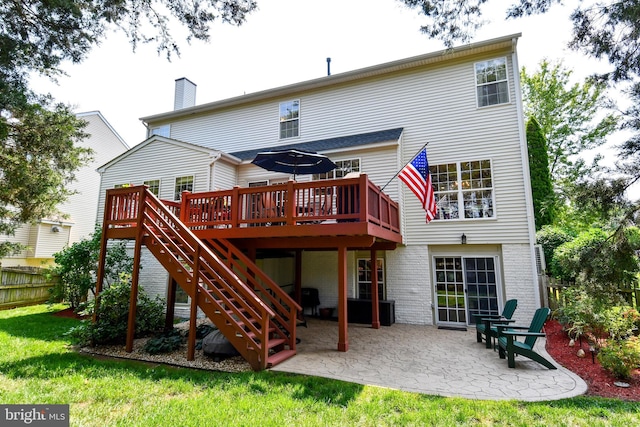 9111 Dartford Pl, Bristow, VA 20136 - rear view of property featuring a wooden deck, a patio, brick siding, and stairway