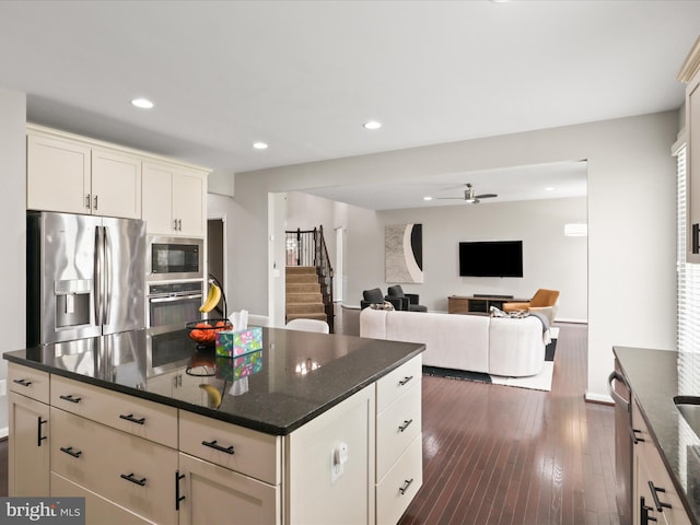 42350 Stonemont Cir, Ashburn, VA 20148 - kitchen featuring stainless steel appliances, ceiling fan, dark wood-style flooring, recessed lighting, and dark stone countertops