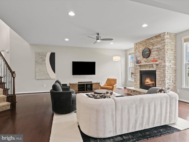 42350 Stonemont Cir, Ashburn, VA 20148 - living area featuring a fireplace, stairs, wood finished floors, healthy amount of natural light, and recessed lighting