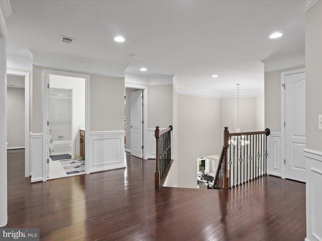 42350 Stonemont Cir, Ashburn, VA 20148 - corridor featuring an upstairs landing, a wainscoted wall, a decorative wall, wood-type flooring, and ornamental molding
