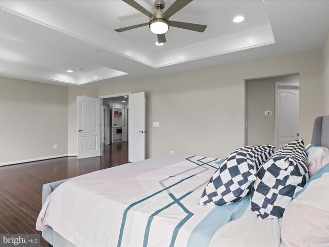 42350 Stonemont Cir, Ashburn, VA 20148 - bedroom featuring a tray ceiling, dark wood finished floors, recessed lighting, ornamental molding, and a ceiling fan