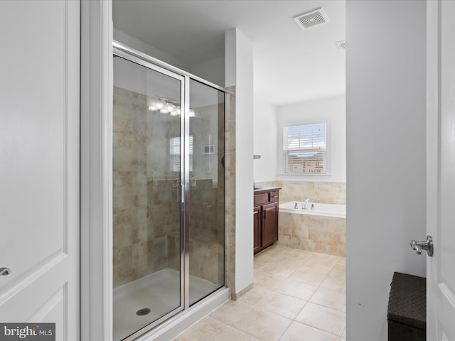 42350 Stonemont Cir, Ashburn, VA 20148 - bathroom with tile patterned floors, a stall shower, vanity, and a bath