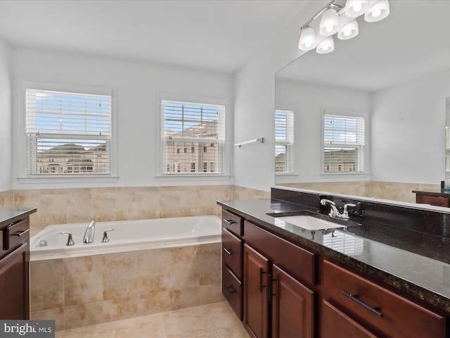 42350 Stonemont Cir, Ashburn, VA 20148 - full bathroom with vanity, a bath, healthy amount of natural light, and tile patterned flooring