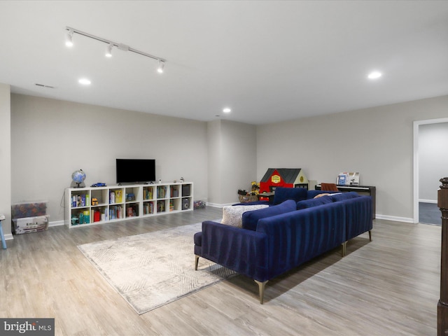 42350 Stonemont Cir, Ashburn, VA 20148 - living area featuring wood finished floors, baseboards, and recessed lighting