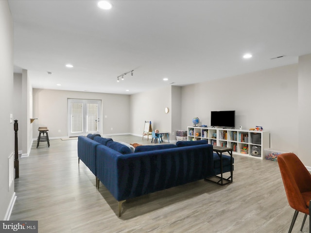 42350 Stonemont Cir, Ashburn, VA 20148 - living room with light wood-style flooring, recessed lighting, and baseboards
