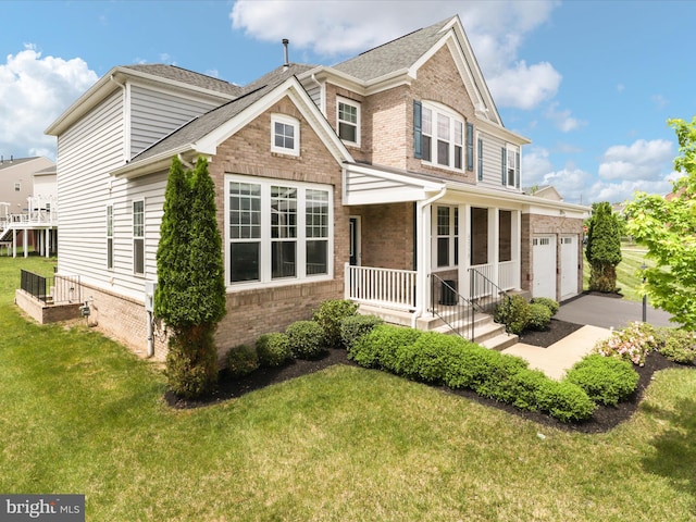 42350 Stonemont Cir, Ashburn, VA 20148 - view of front of property with brick siding, a front lawn, covered porch, driveway, and a shingled roof