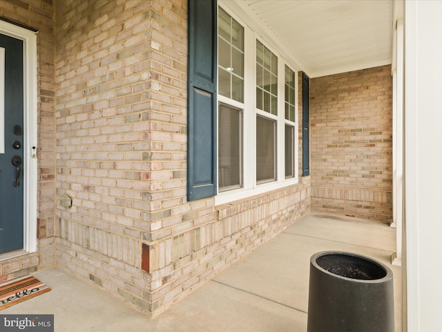 42350 Stonemont Cir, Ashburn, VA 20148 - doorway to property featuring brick siding and a porch