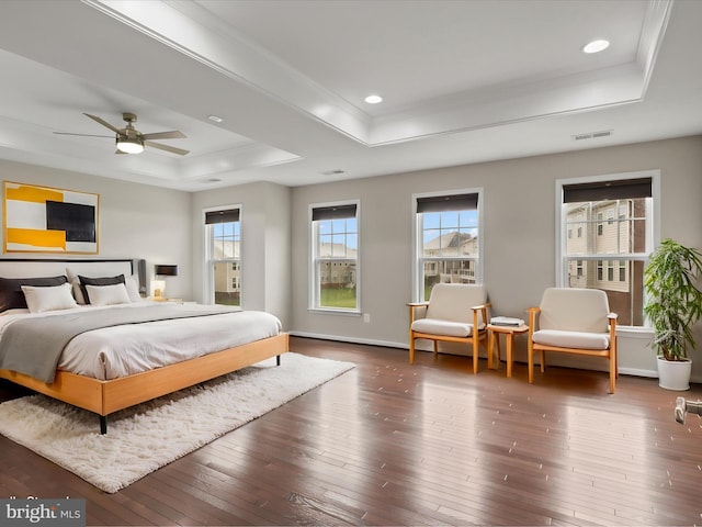 42350 Stonemont Cir, Ashburn, VA 20148 - bedroom with a tray ceiling, multiple windows, crown molding, hardwood / wood-style flooring, and recessed lighting