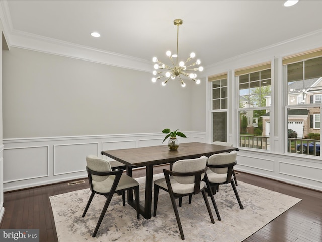 42350 Stonemont Cir, Ashburn, VA 20148 - dining space with ornamental molding, a chandelier, hardwood / wood-style floors, wainscoting, and a decorative wall