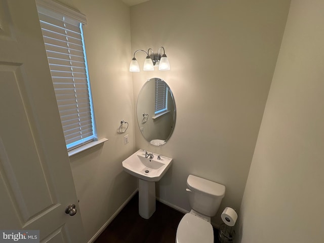 12139 Fallen Timbers Cir, Hagerstown, MD 21740 - half bathroom featuring toilet, baseboards, wood finished floors, and a sink