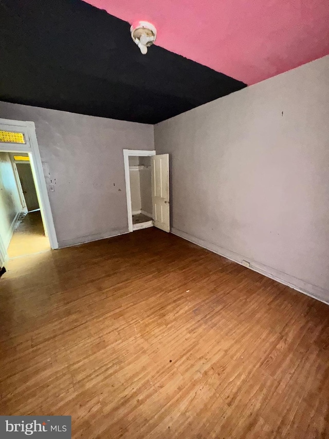 328 S Payson St, Baltimore, MD 21223 - spare room with wood finished floors