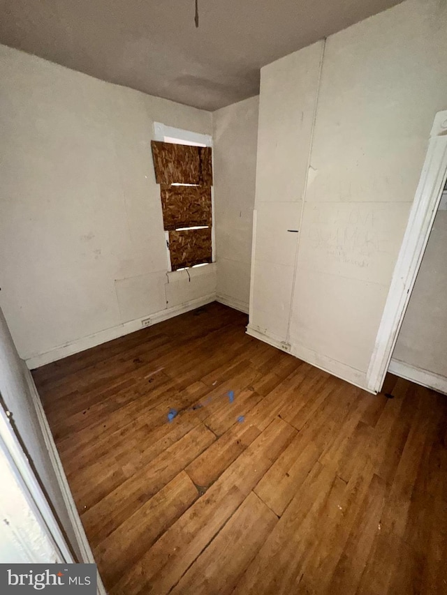 328 S Payson St, Baltimore, MD 21223 - unfurnished bedroom featuring wood finished floors