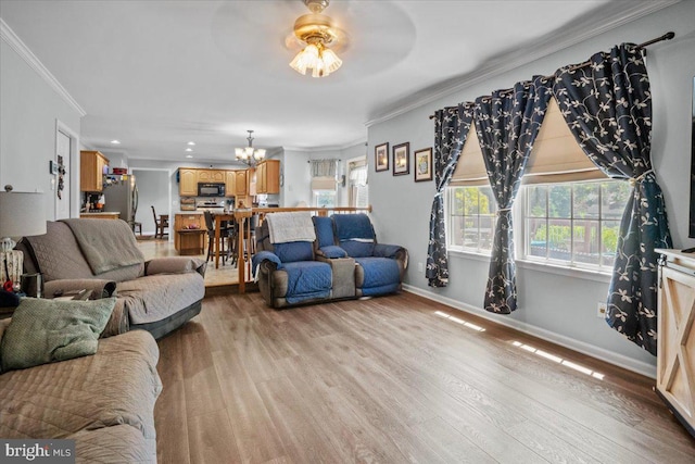 4127 Ford Dr, Emmaus, PA 18049 - living area featuring a chandelier, healthy amount of natural light, crown molding, light wood finished floors, and baseboards