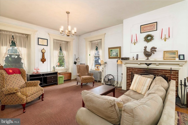 559 Righter St, Philadelphia, PA 19128 - sitting room featuring radiator, a chandelier, a fireplace, and carpet flooring