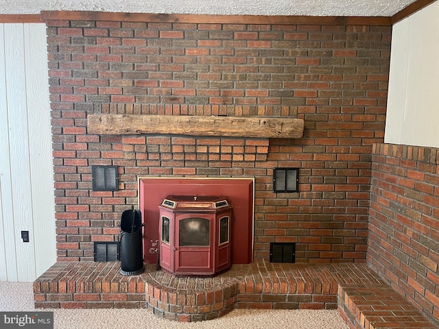 517 S Wayne St, Lewistown, PA 17044 - detailed view of a wood stove, carpet floors, and brick wall