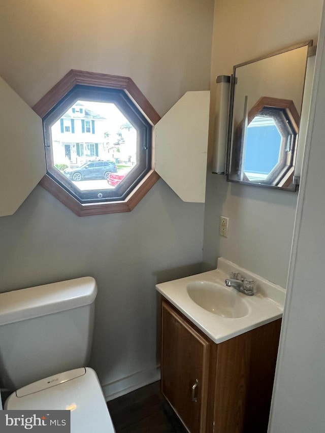 517 S Wayne St, Lewistown, PA 17044 - bathroom featuring vanity, toilet, and plenty of natural light