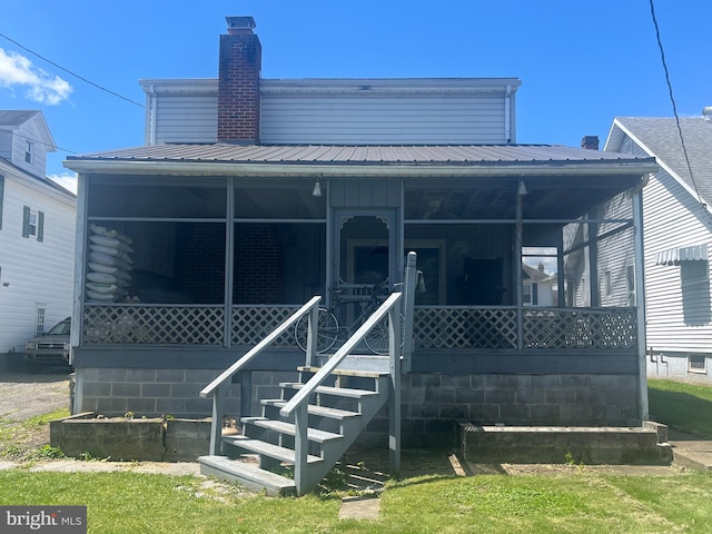 517 S Wayne St, Lewistown, PA 17044 - back of property with a porch, a chimney, and metal roof