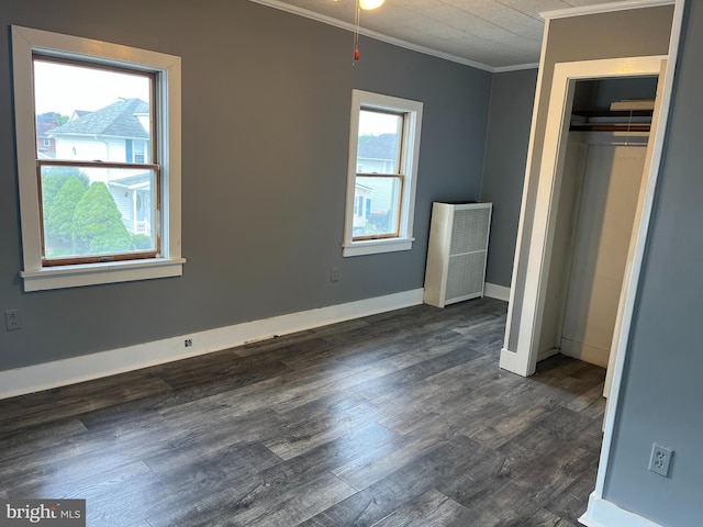 517 S Wayne St, Lewistown, PA 17044 - unfurnished bedroom with crown molding, dark wood-style flooring, a closet, and baseboards