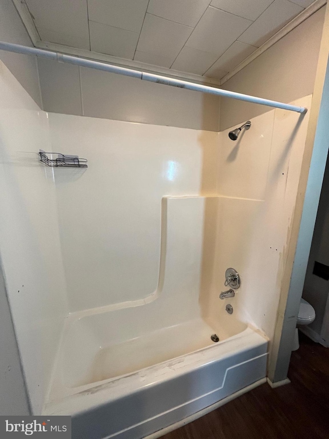 517 S Wayne St, Lewistown, PA 17044 - bathroom featuring toilet, shower / bathtub combination, and wood finished floors