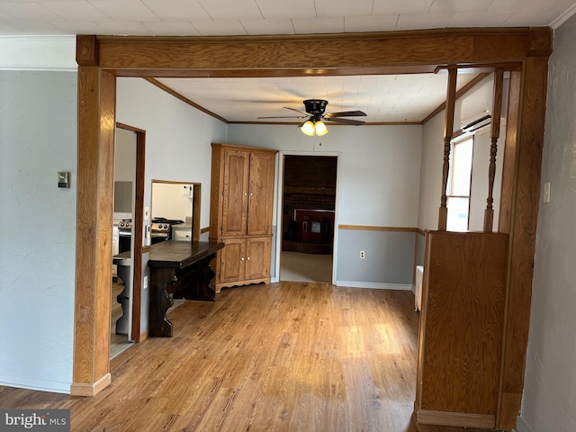 517 S Wayne St, Lewistown, PA 17044 - unfurnished dining area with crown molding, light wood-style floors, a ceiling fan, and baseboards