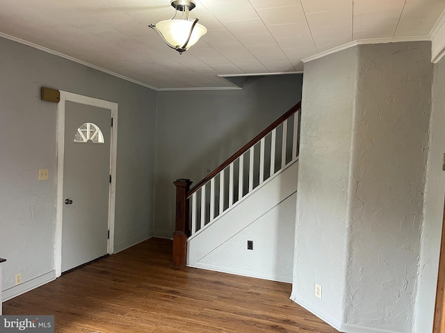 517 S Wayne St, Lewistown, PA 17044 - entryway with crown molding, stairway, wood finished floors, and a textured wall