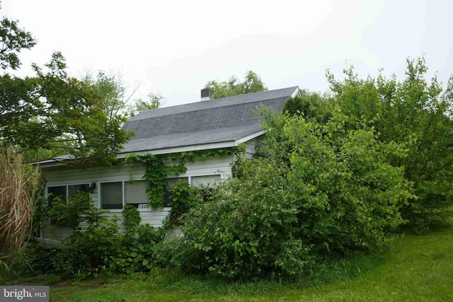 113 Sturgill Dr, Bel Air, MD 21015 - view of home's exterior with a gambrel roof, a chimney, and roof with shingles