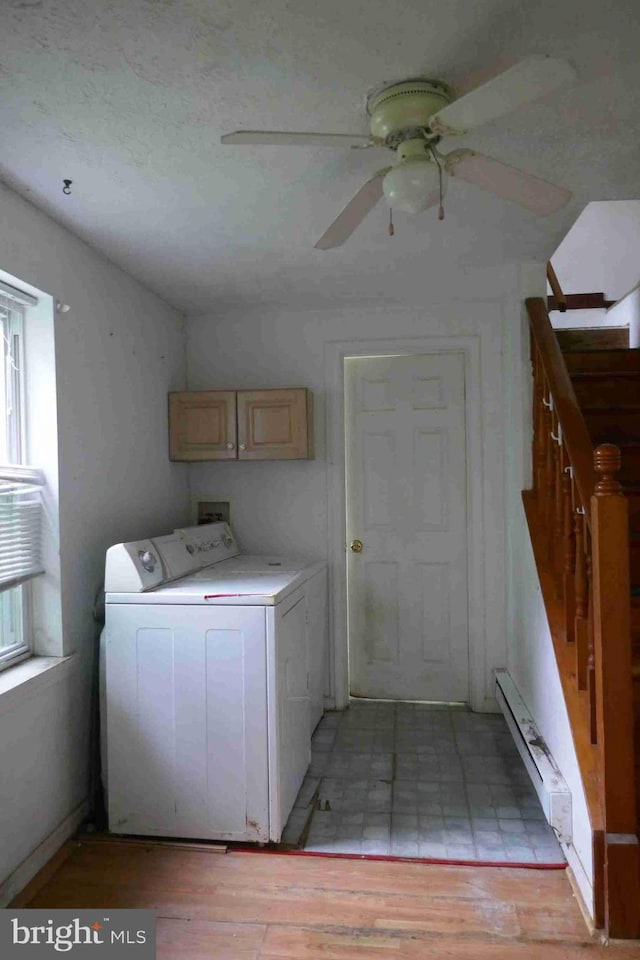 113 Sturgill Dr, Bel Air, MD 21015 - laundry area with cabinet space, a ceiling fan, light wood finished floors, baseboard heating, and washer and dryer