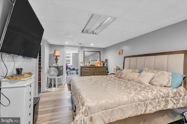 859 Columbia Ave, Newfield, NJ 08344 - bedroom featuring light wood-style flooring and a paneled ceiling