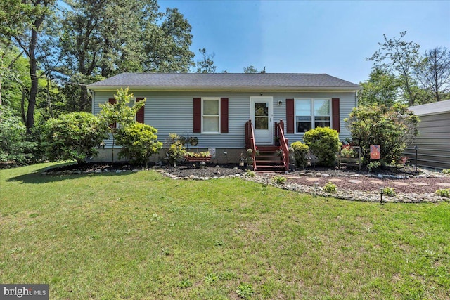 859 Columbia Ave, Newfield, NJ 08344 - view of front facade with a front lawn